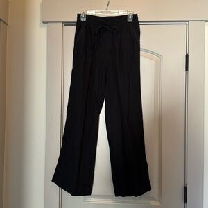 Black cotton flowy pants. Size medium Briggs brand. Worn once. Flattering fit.